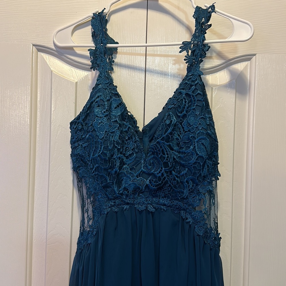 Beautiful Turquoise Lace Dress with peekaboo sides